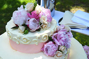Pink and white speciality cake, decorate with flowers