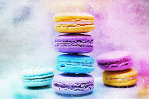 Colourful macarons stacked in rows